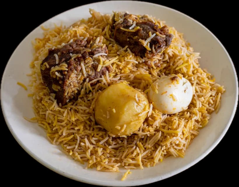 Kolkata mutton biryani with its potato and egg