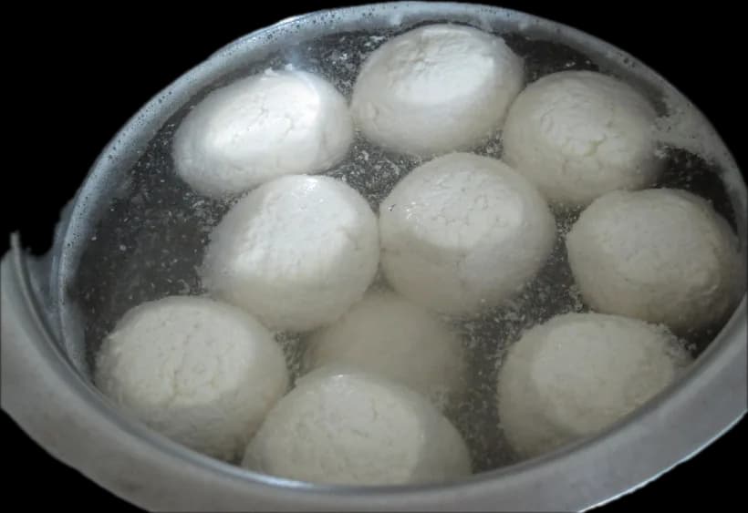 Rosogolla in syrup in a steel pot