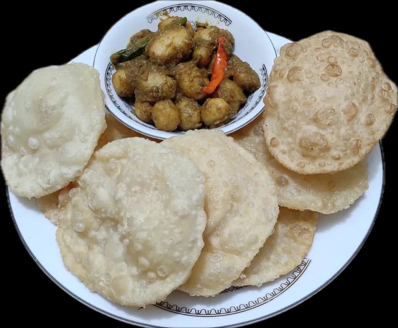 Luchi around a bowl of alur dom