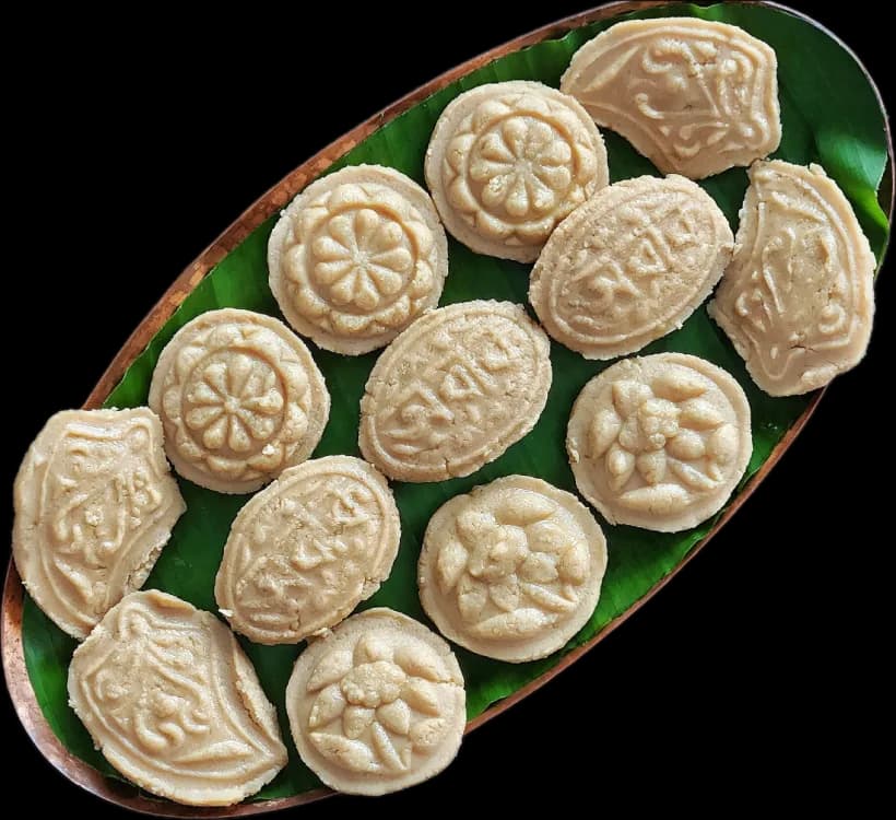 Moulded gur sandesh on a banana leaf