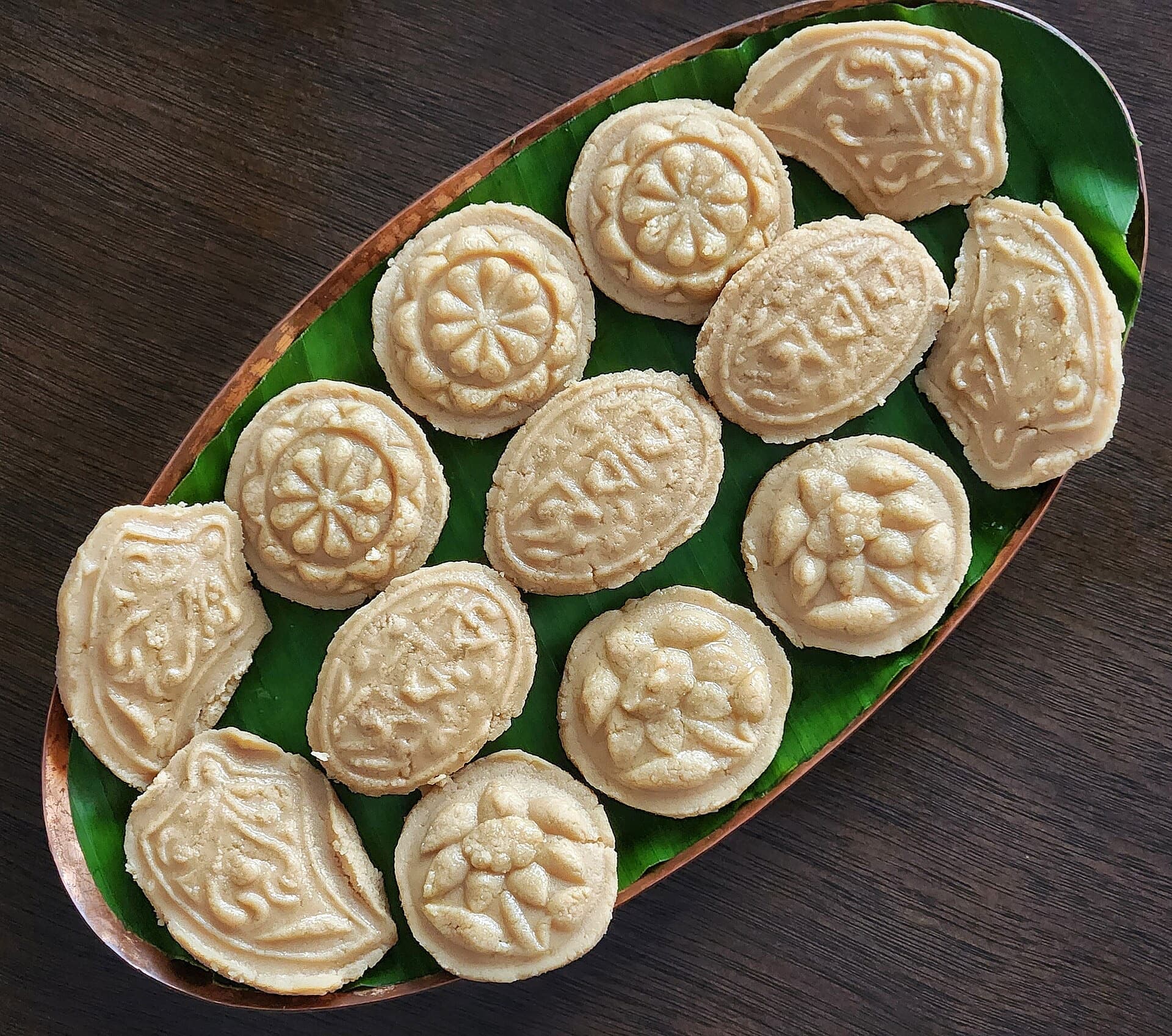 Moulded gur sandesh on a banana leaf
