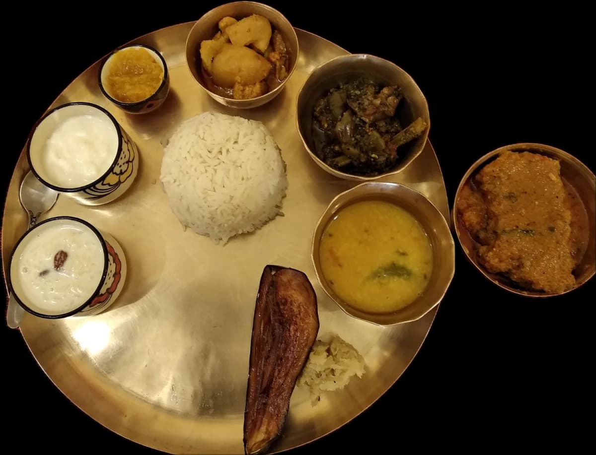 A Bengali thali on bell metal, seen from above